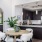 Quartz countertops and dark cabinets in apartment kitchen