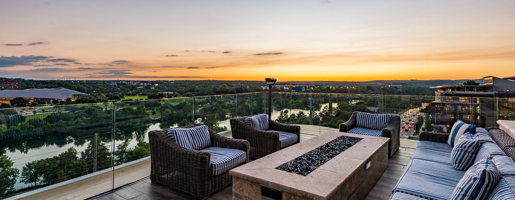 Large fire pit with seating overlooking the city 