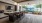 Spacious clubroom with bar seating and a large window withe a view 